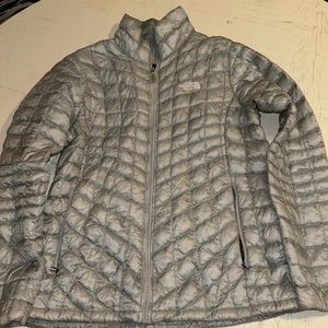 The North Face zip up puffer. Size Large